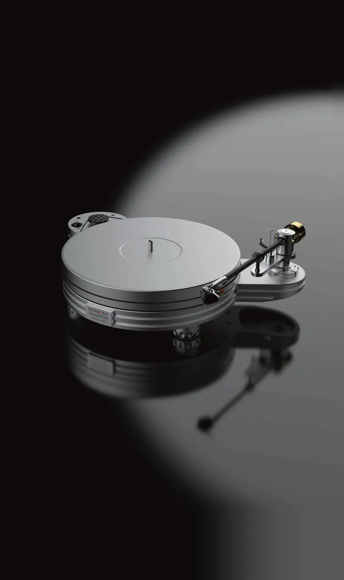 An Acoustic Signature Merlin NEO turntable in silver with its tonearm, mirrored in the black surface beneath it