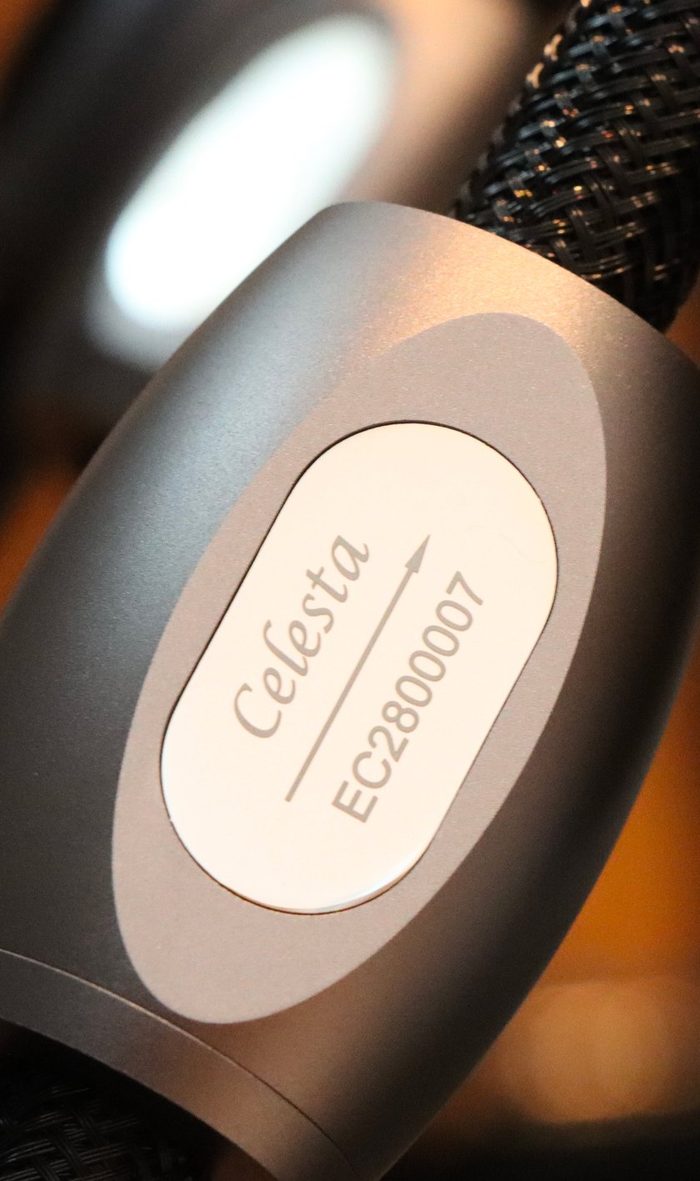 The Celesta badge on a black braided cable