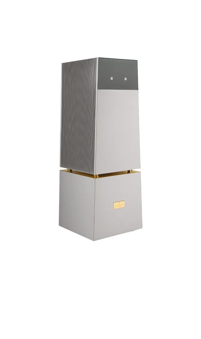 A Goldmund Telos 9800 mono power amplifier, a tall column in silver-grey with a gold band, on white
