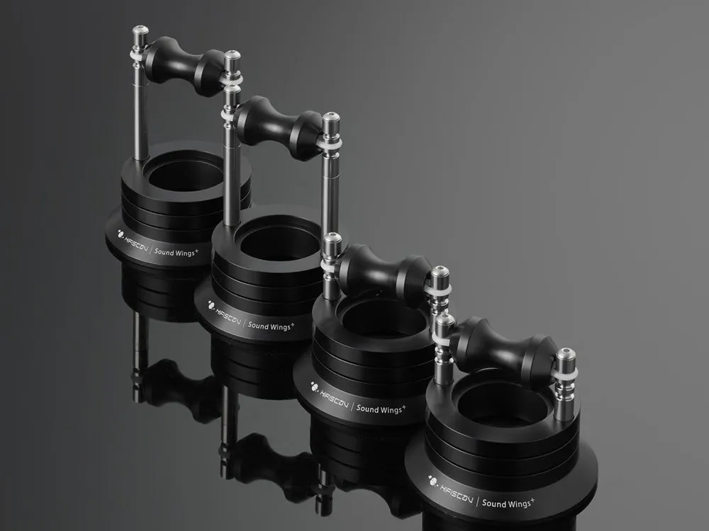 Four Sound Wings+ cable lifters in a row on black, their reflections under them