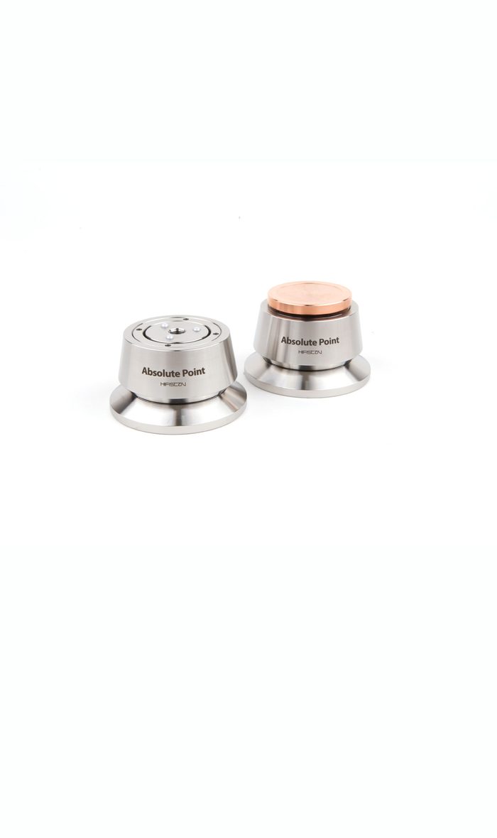 Two Absolute Point feet in stainless steel on white, one with a copper cap