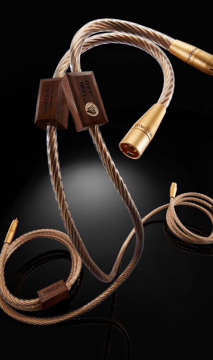 Odin Gold analogue interconnects with their gold Holo:Plug connectors and walnut blocks, on black