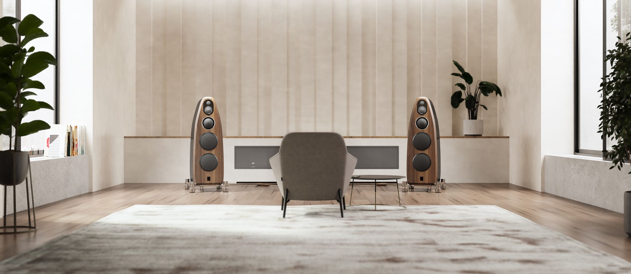Loudspeakers and an armchair in a daylit living room