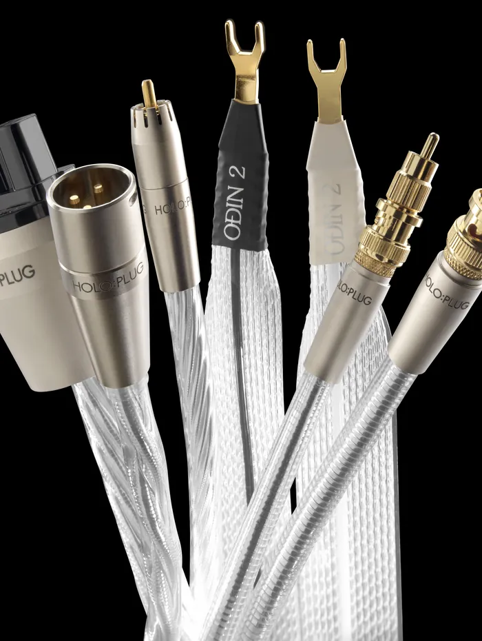 Nordost Odin 2 cables fanned out on black, their HOLO:PLUG connectors and spades uppermost