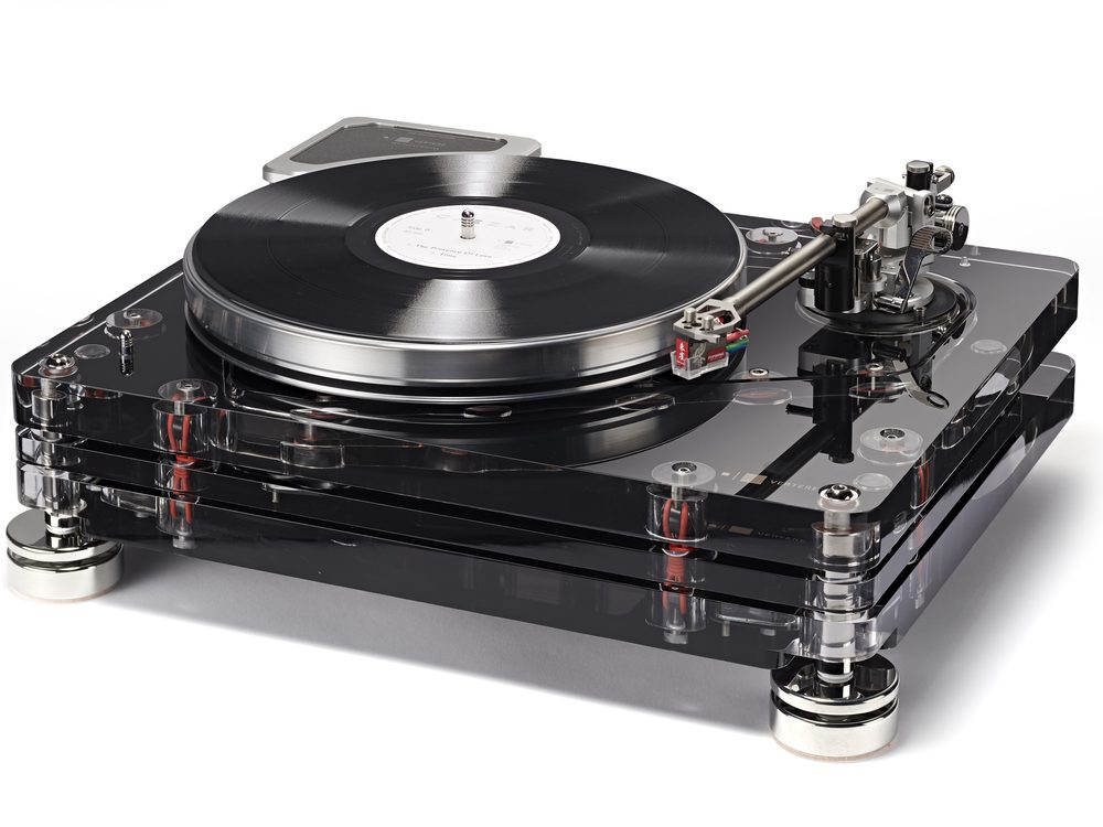 An RG-1 Reference Groove record player in black acrylic on white, a record on the platter