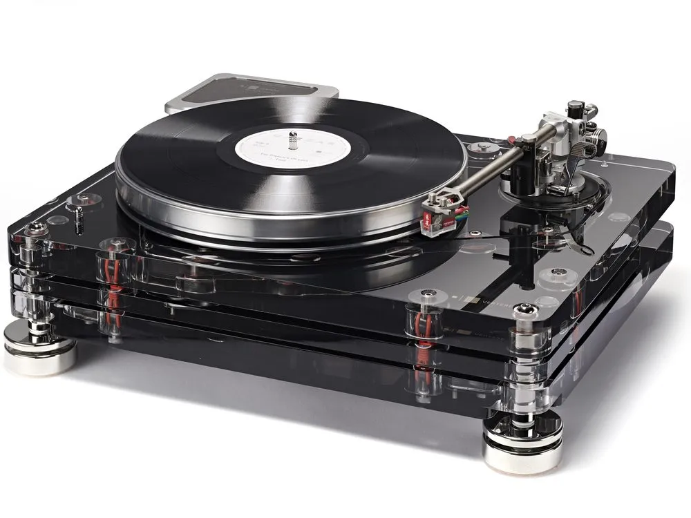 An RG-1 Reference Groove record player in black acrylic on white, a record on the platter