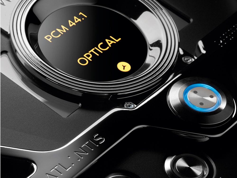 The top plate of an Atlantis Reference DAC, close: the round display reading PCM 44.1 Optical, and a blue-ringed button